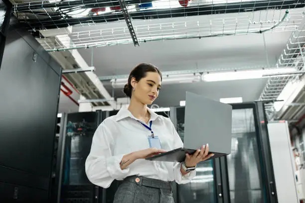 Network engineer conducting server maintenance inside an enterprise data center facility